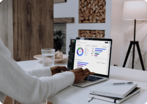 IT-MacBook Pro mockup on white table with notebook by the side (Mockuuups Studio)